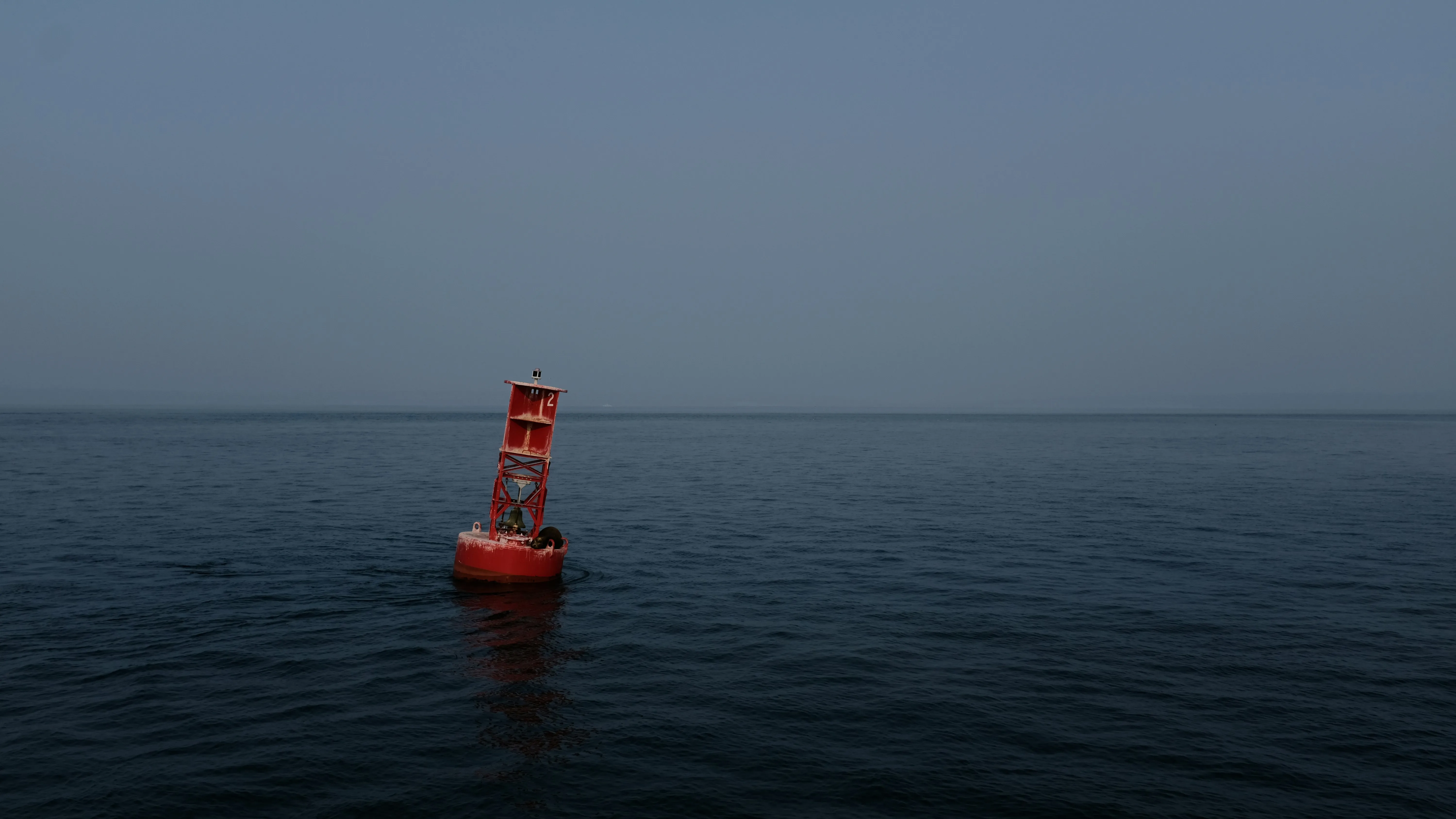 Orange buoy floating in the water