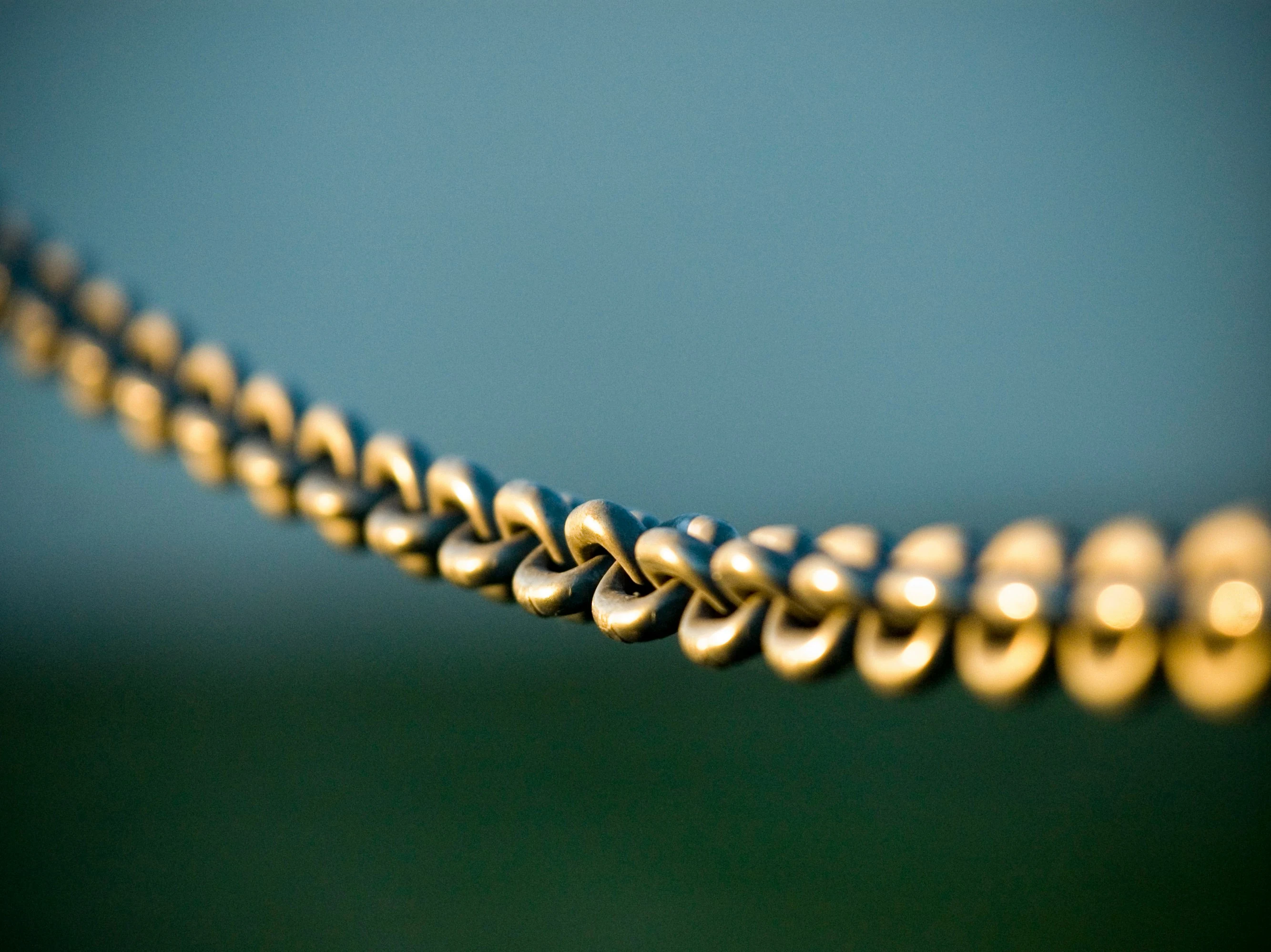 tilt shift photography of gray steel chains